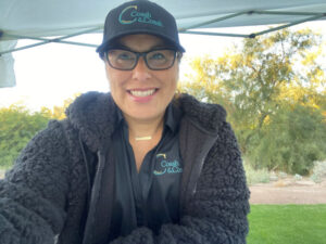 Image of Cristina Coash representing the Maricopa County court reporting services of Coash & Coash at the Los Abogados golf tournament in Phoenix, AZ.