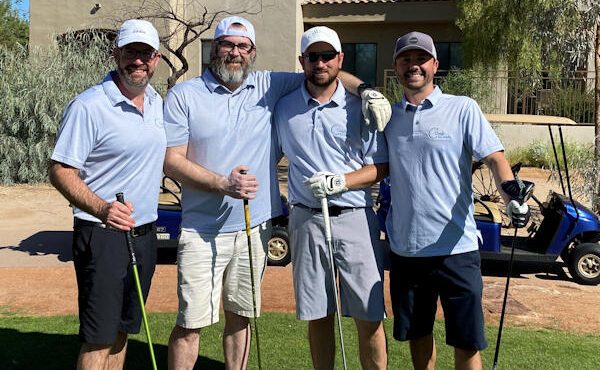 Image of Jerry Coash and the Coash &Coash Court Reporting and Video golf team at the Los Abogados golf tournament, an event that allows the firm to contribute to the Phoenix community.